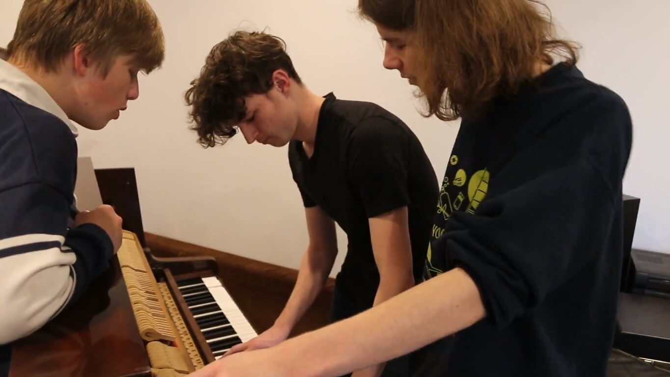 Gathered around the piano